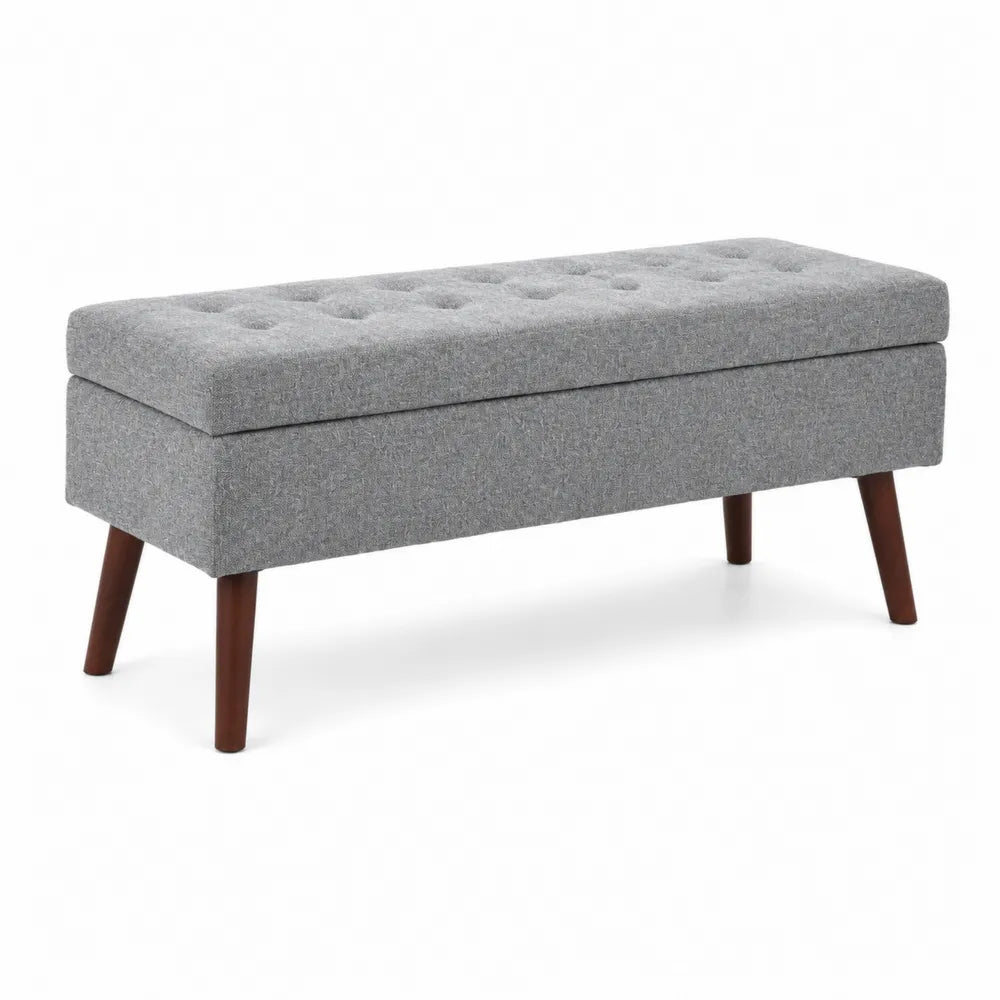 Banc de rangement en tissu gris avec pieds en bois